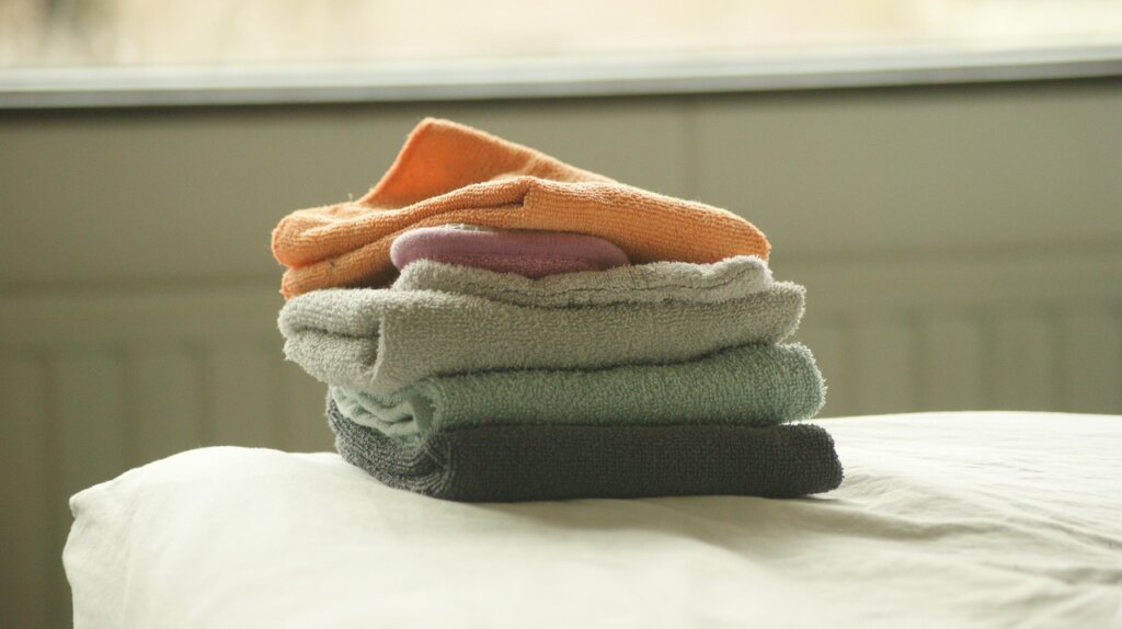 neatly folded underwear and socks arranged vertically in small drawer