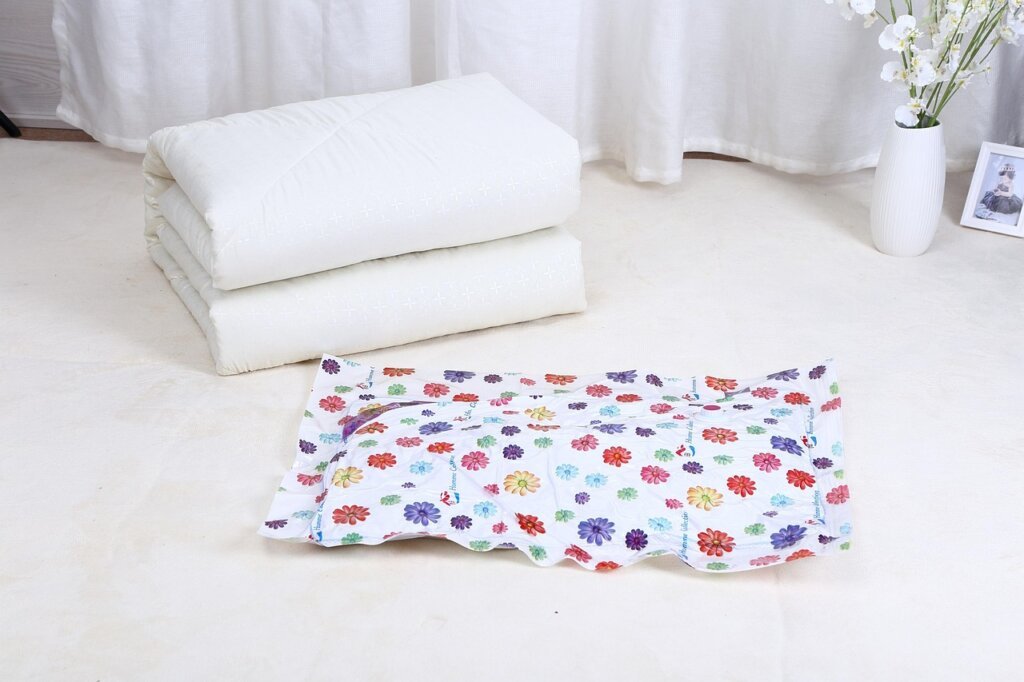 vacuum storage bag with seasonal clothes compressed flat