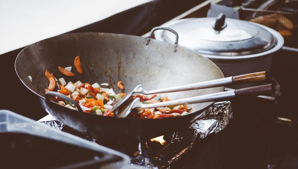 frying pan steam rising with bay leaves on stove