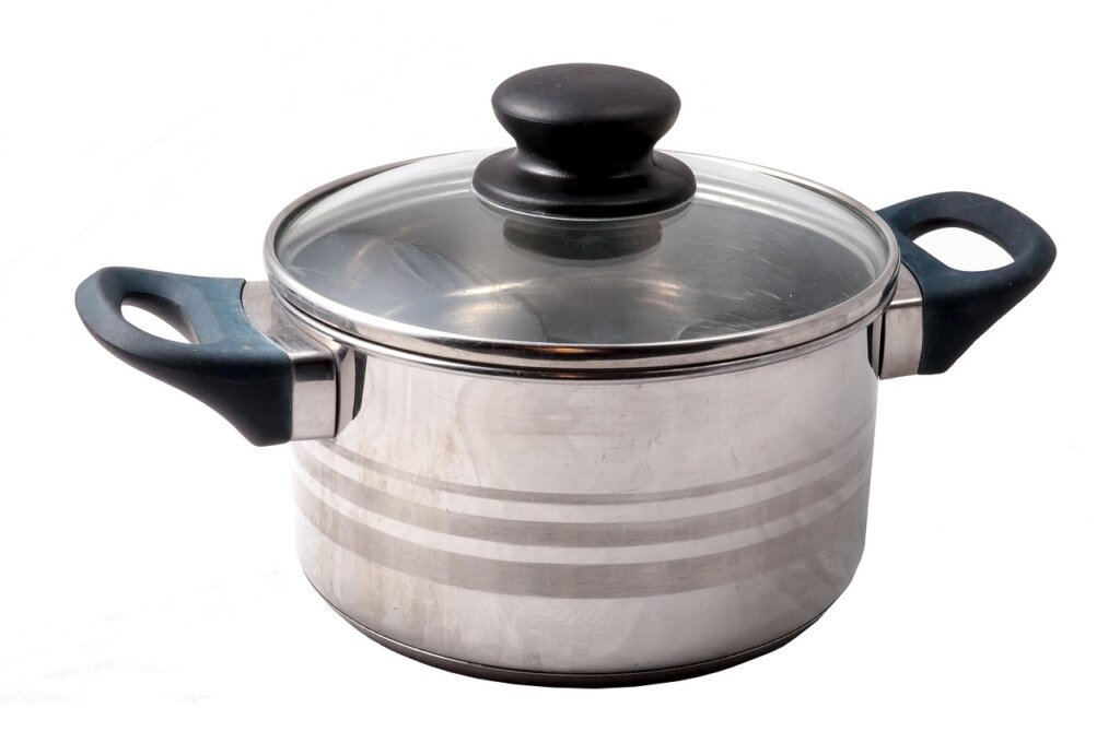 white vinegar bottle next to stainless steel pot on kitchen counter