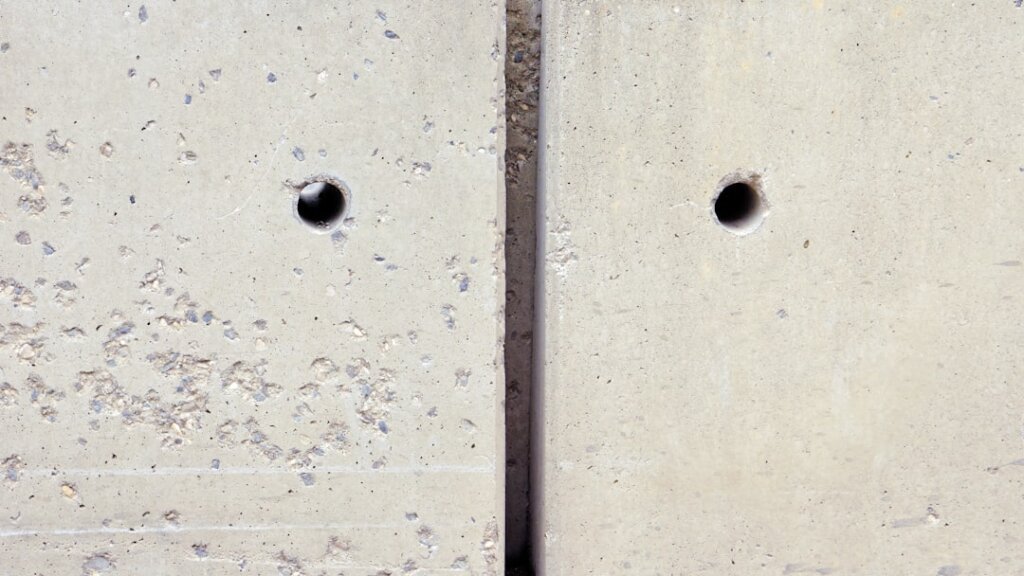 before and after comparison of nail hole in white wall, left side shows hole, right side shows repaired smooth surface