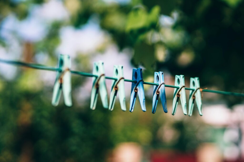 towels drying in bright sunlight on clothesline outside