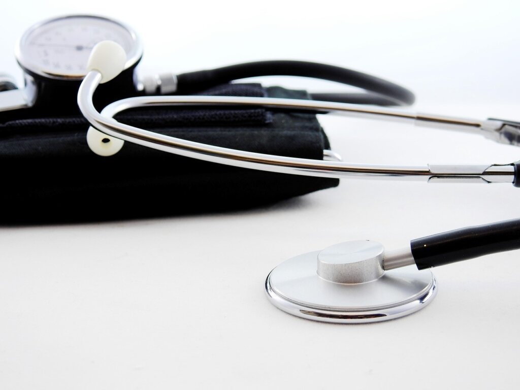 blood test tube and vitamin deficiency report on doctor desk