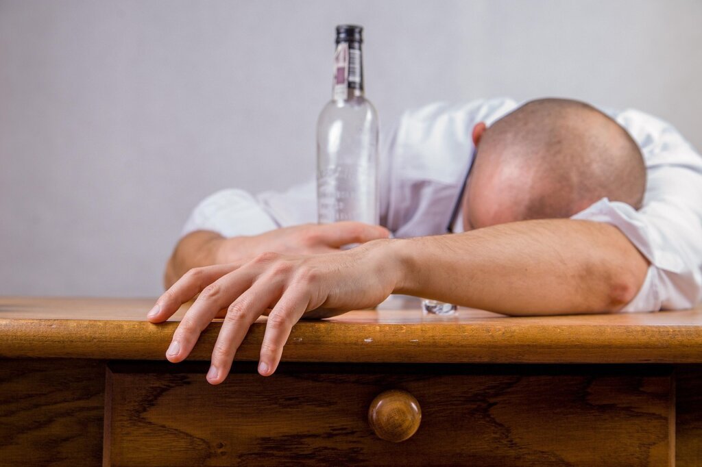 sunflower seeds and supplement bottle on wooden table