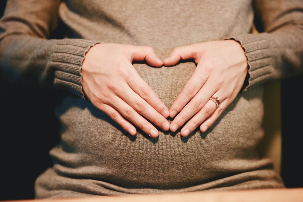 pregnant woman consulting doctor about supplements safety